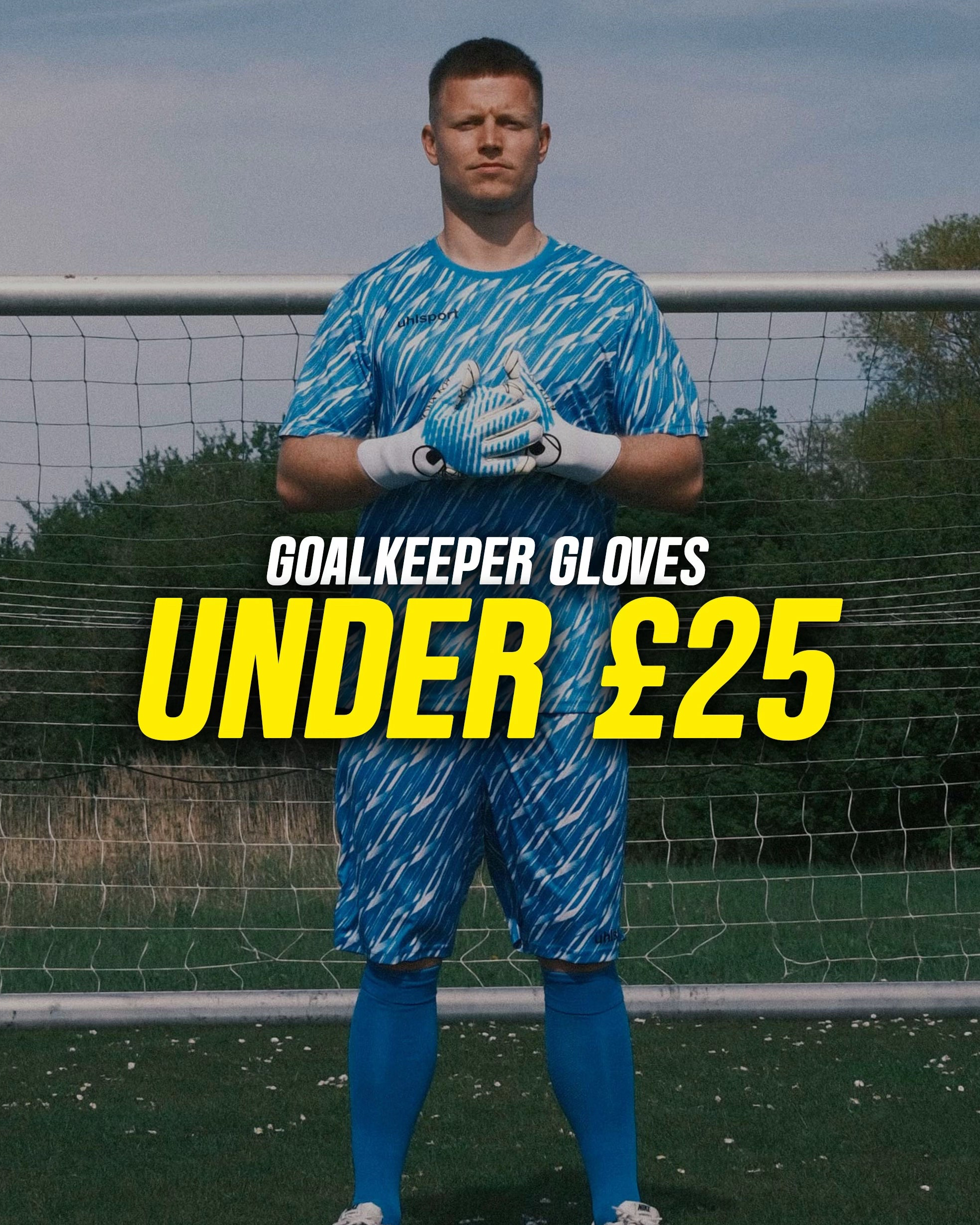 A man wearing a blue patterned soccer goalkeeper jersey, shorts, socks, and gloves stands in front of a goal net on a grass field, with large overlaid text reading 'GOALKEEPER GLOVES UNDER £25' and a small '@justkeepers' handle in the corner.